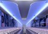 Illustration of the Airspace cabin interior in the Airbus A220 featuring enlarged overhead bins for carry-on luggage and new lighting