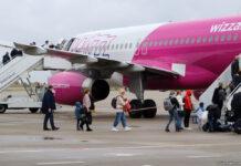 Passengers are boarding a Wizz Air plane