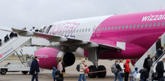 Passengers are boarding a Wizz Air plane