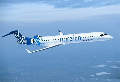 Самолет в ливрее Nordica со стрекозой на борту