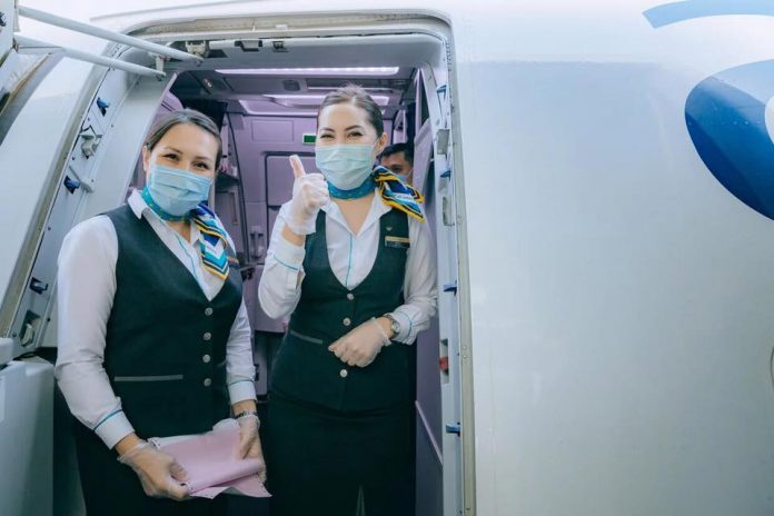 Бортпроводники Air Astana в масках