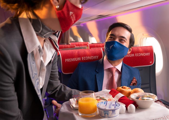Пассажир в премиум-эконом-классе на борту Air Astana